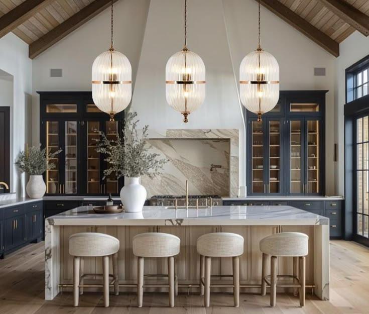 Large kitchen with marble countertops and blue cabinetry