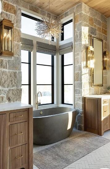 Elegant bathroom with natural stone and wood finishes